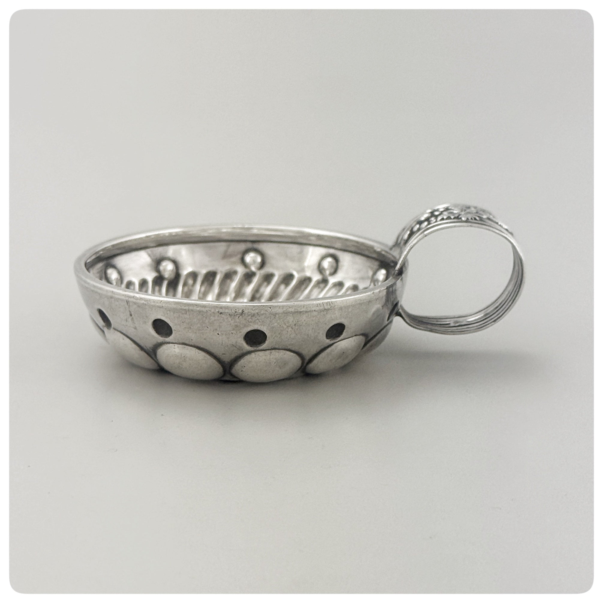 First Standard (950/1000) Solid Silver Wine Taster / Tastevin with Embossed Strap Handle, Paris, Circa 1878