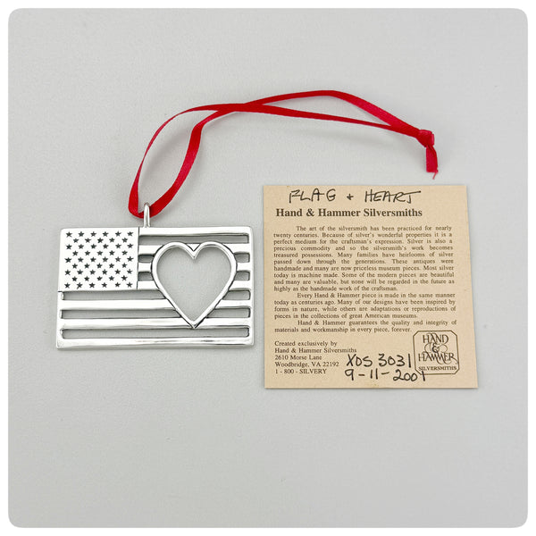 Ornament and paper, American Sterling Silver Handwrought Ornament, Flag and Heart, Hand & Hammer, Woodbridge, VA, 2001 - The Silver Vault of Charleston