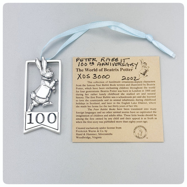 Ornament and paper, American Sterling Silver Handwrought Commemorative Ornament, The World of Beatrix Potter, Hand & Hammer, Woodbridge, VA, 2002 -The Silver Vault of Charleston