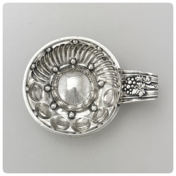 First Standard (950/1000) Solid Silver Wine Taster / Tastevin with Embossed Strap Handle, Paris, Circa 1878