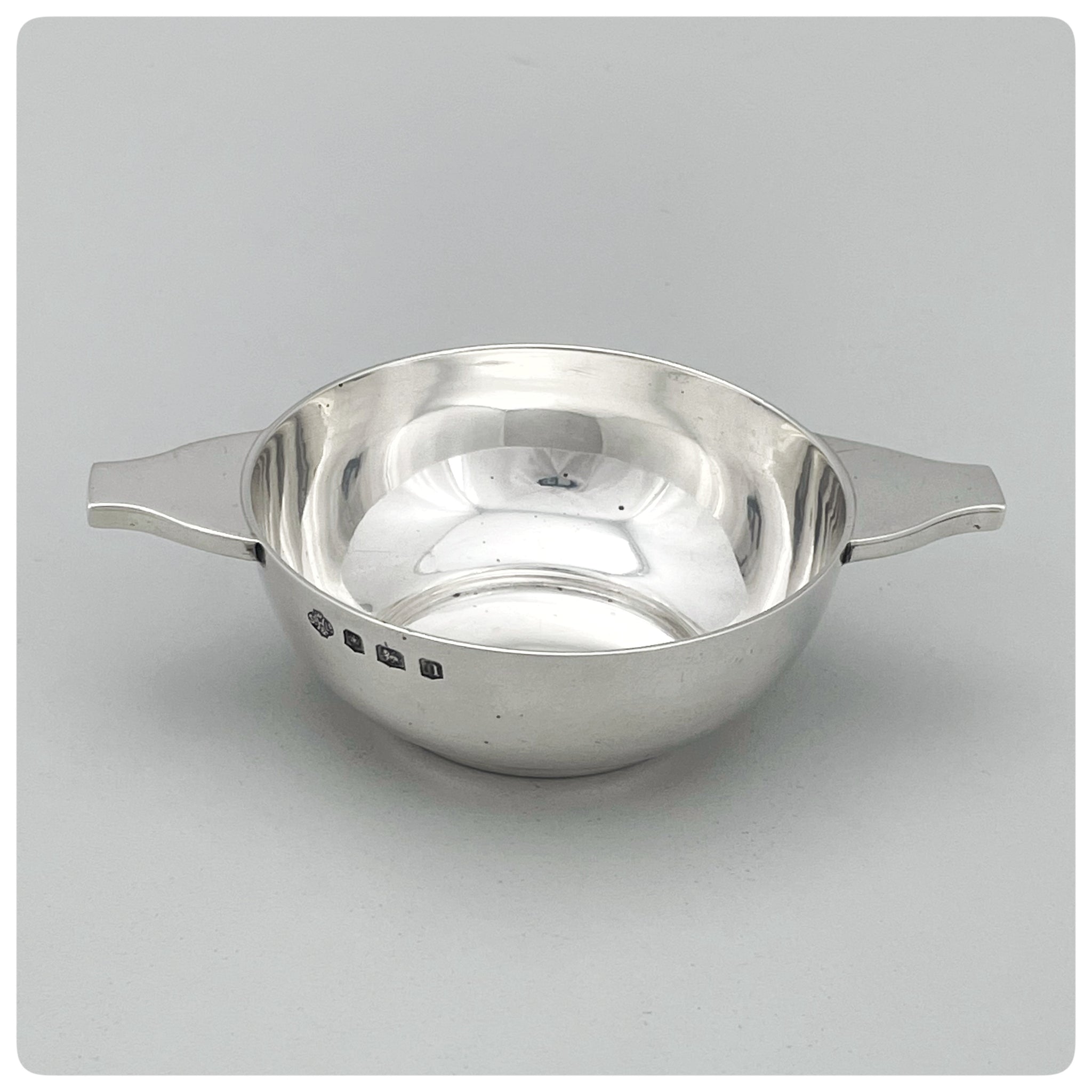 English Sterling Silver Quaich, W. Hutton & Sons Ltd., Sheffield, 1930-1931. Angled view of the side and top, including maker's marks
